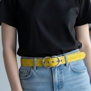 Yellow, wide, crocodile-embossed leather belt featuring a distinctive double-ova